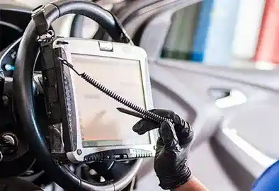 Technician running ADAS camera calibration after windshield replacement in Memphis