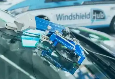 Resin injection tool repairing a windshield chip in Memphis