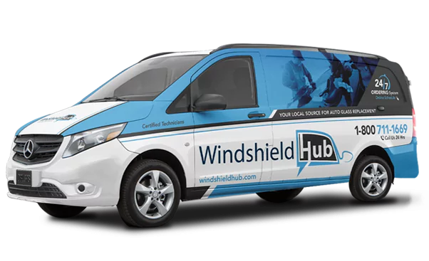 A Mercedes van with Windshield Hub company branding and advertising on its side