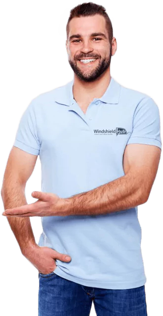 A man in a light blue polo shirt with WindshieldHUB logo smiles and points to the right