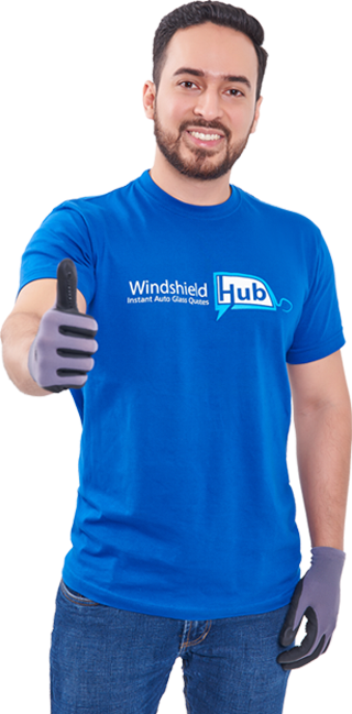 WindshieldHUB technician smiling and giving thumbs up while wearing branded blue uniform and gloves